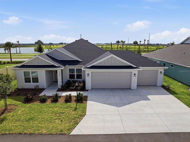 Front exterior of a new home in , The Villages, FL, highlighting curb appeal (Image 2). Front exterior of a new home in , The Villages, FL, highlighting curb appeal (Image 2).