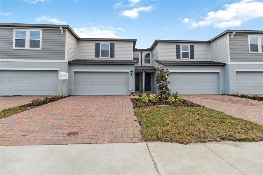 Front exterior of a new home in , St. Cloud, FL, highlighting curb appeal (Image 24).