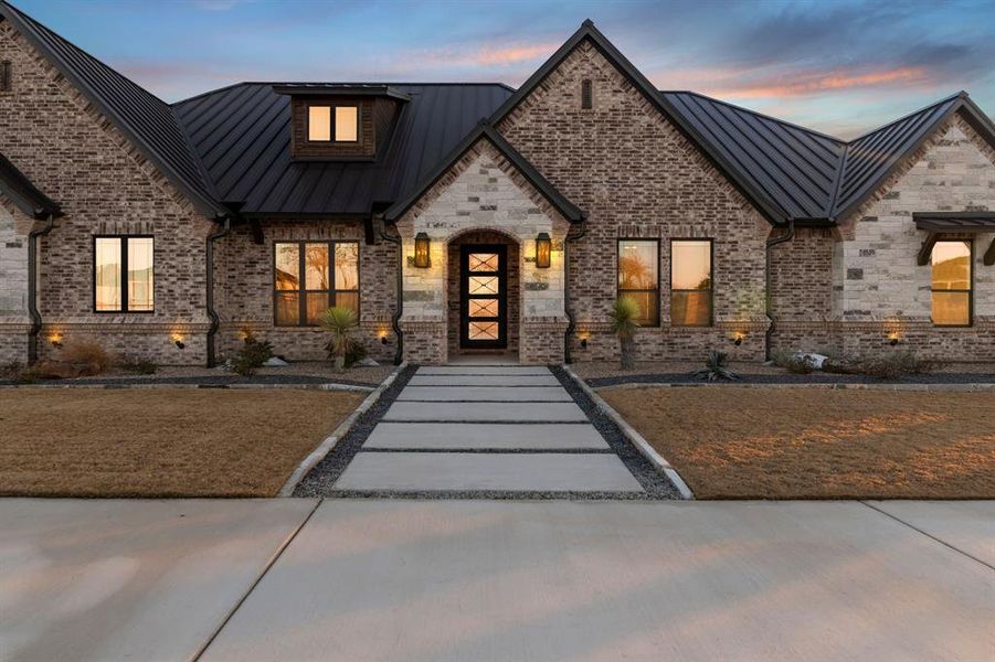 Front exterior of a new home in Santana Ridge, Weatherford, TX, highlighting curb appeal (Image 2). Front exterior of a new home in Santana Ridge, Weatherford, TX, highlighting curb appeal (Image 2).