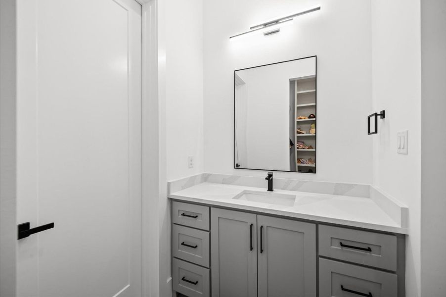 Secondary full bathroom offers modern finishes and designer-selected fixtures.