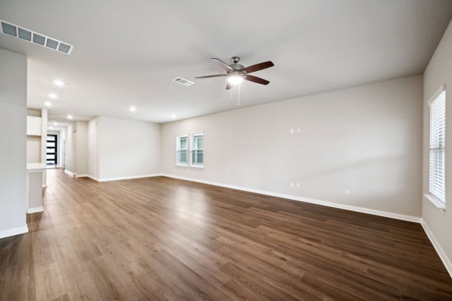 Living room and dining room in the Reynolds floorplan at a Meritage Homes community.