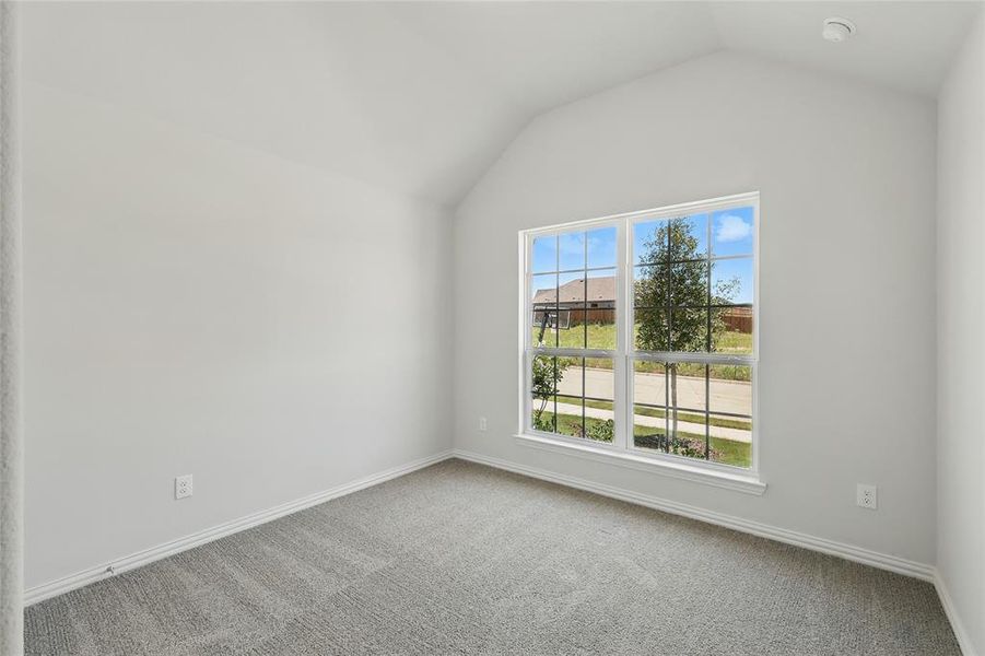 Carpeted empty room with baseboards