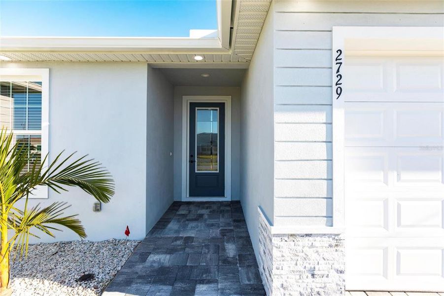 Front exterior of a new home in , Cape Coral, FL, highlighting curb appeal (Image 19).