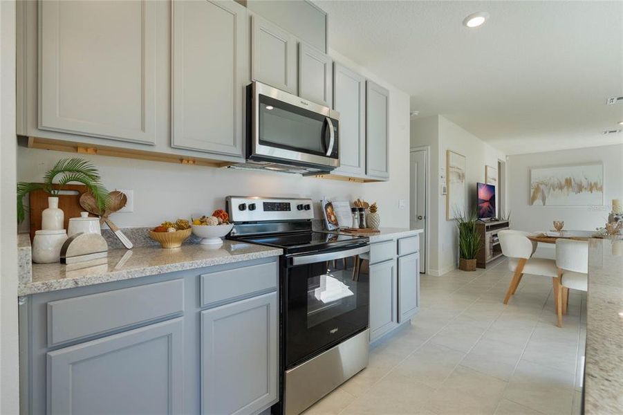 Furnished interior view inside a new home in Lake Deer Estates, Poinciana (Image 12).