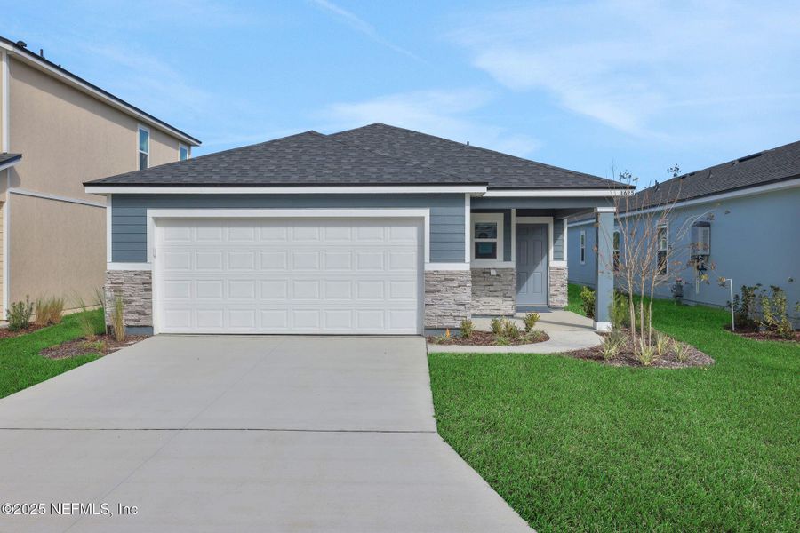 Front exterior of a new home in Cedar Creek, Jacksonville, FL, highlighting curb appeal (Image 21).