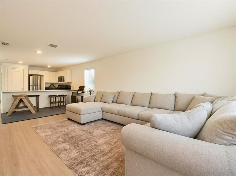 Family Room featuring recessed lighting and light wood-style flooring Family Room featuring recessed lighting and light wood-style flooring