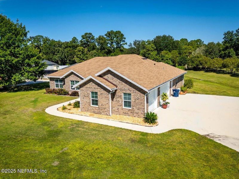 Front exterior of a new home in , Callahan, FL, highlighting curb appeal (Image 1).
