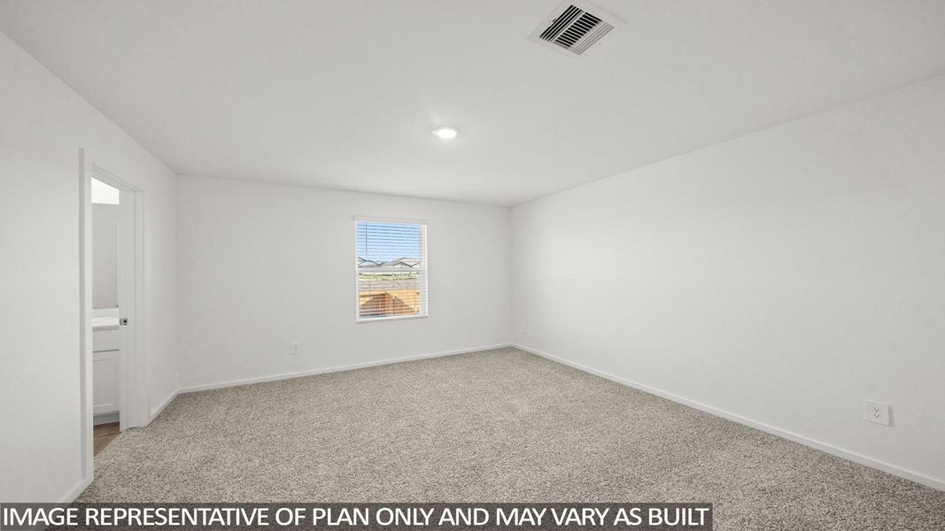 A well-lit bedroom features plush carpeting and a bright window with horizontal blinds.