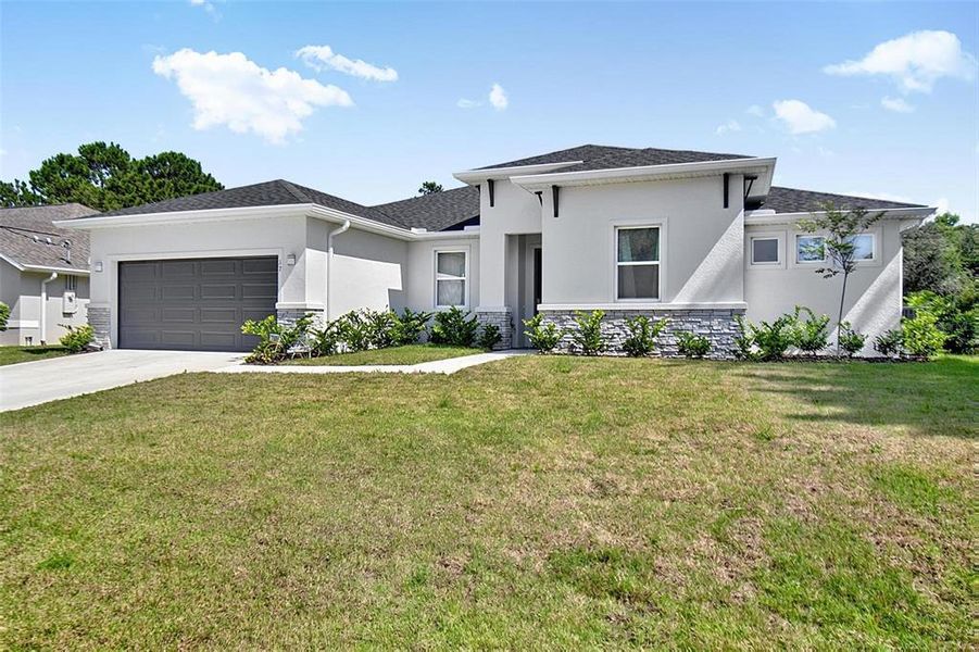 Front exterior of a new home in , Palm Coast, FL, highlighting curb appeal (Image 27).