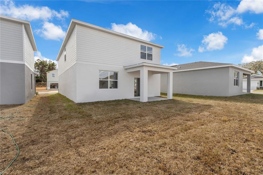 Exterior details and patio area of a home in Watermark, Cocoa (Image 26).