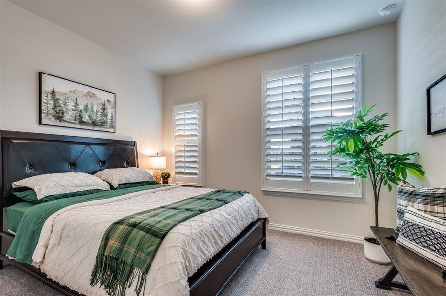Bedroom featuring baseboards and carpet flooring