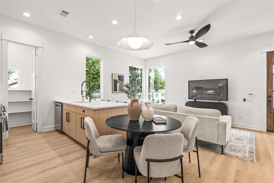 Cozy dining area adjacent to the kitchen island and main living space. Cozy dining area adjacent to the kitchen island and main living space.