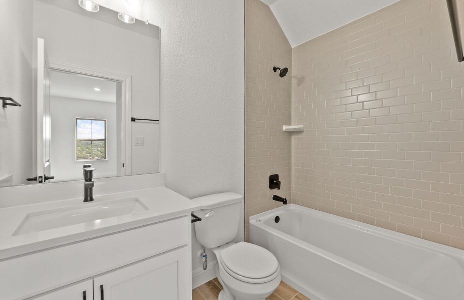 Furnished interior view inside a new home in West Cypress Hills, Spicewood (Image 6).