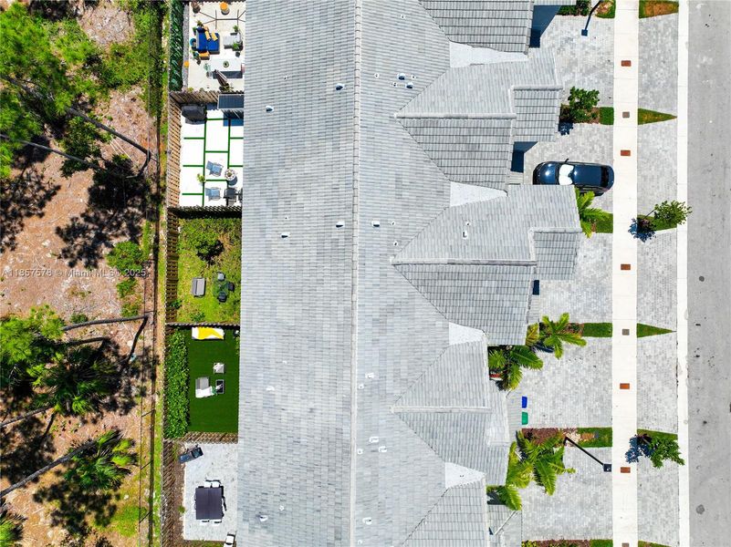 Front exterior of a new home in , Homestead, FL, highlighting curb appeal (Image 21).