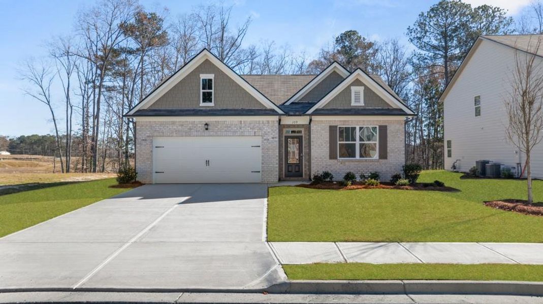 Front exterior of a new home in Northwoods at Mirror Lake, Villa Rica, GA, highlighting curb appeal (Image 18).