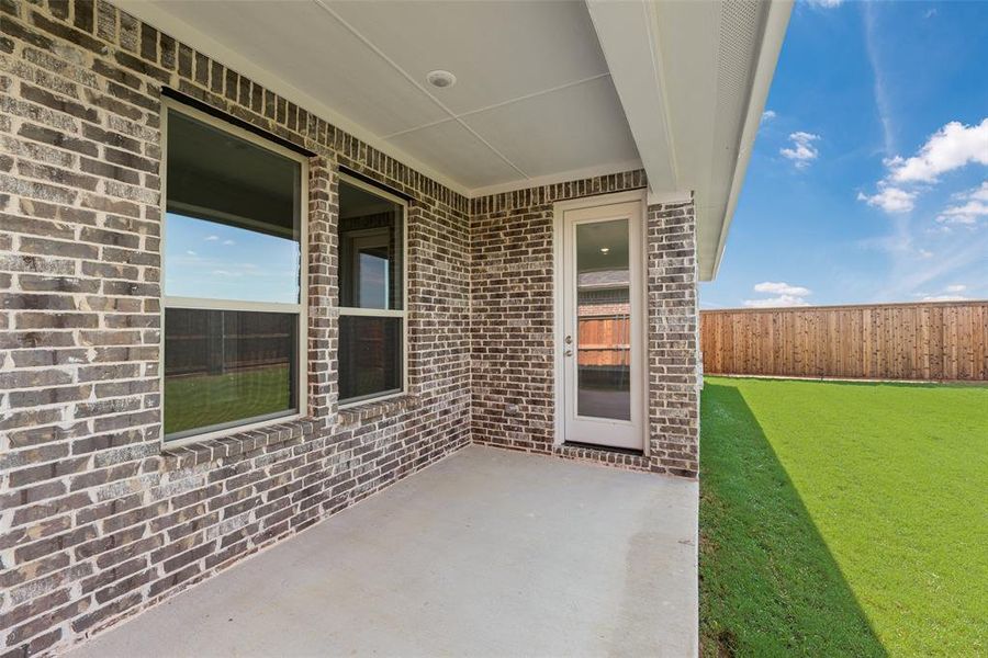 Exterior details and patio area of a home in Spiritas Ranch, Little Elm (Image 4). Exterior details and patio area of a home in Spiritas Ranch, Little Elm (Image 4).
