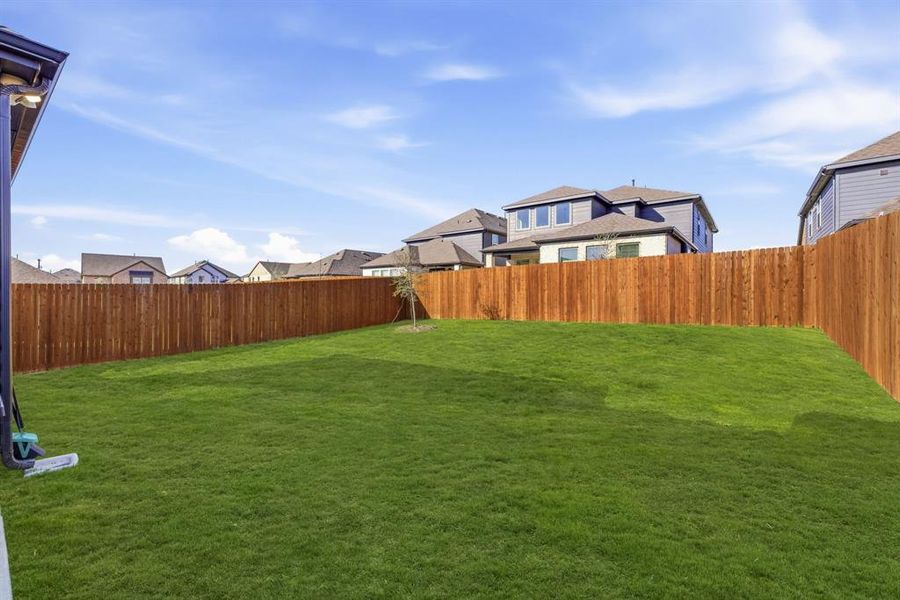 Exterior details and patio area of a home in The Villages of Hurricane Creek, Anna (Image 22).