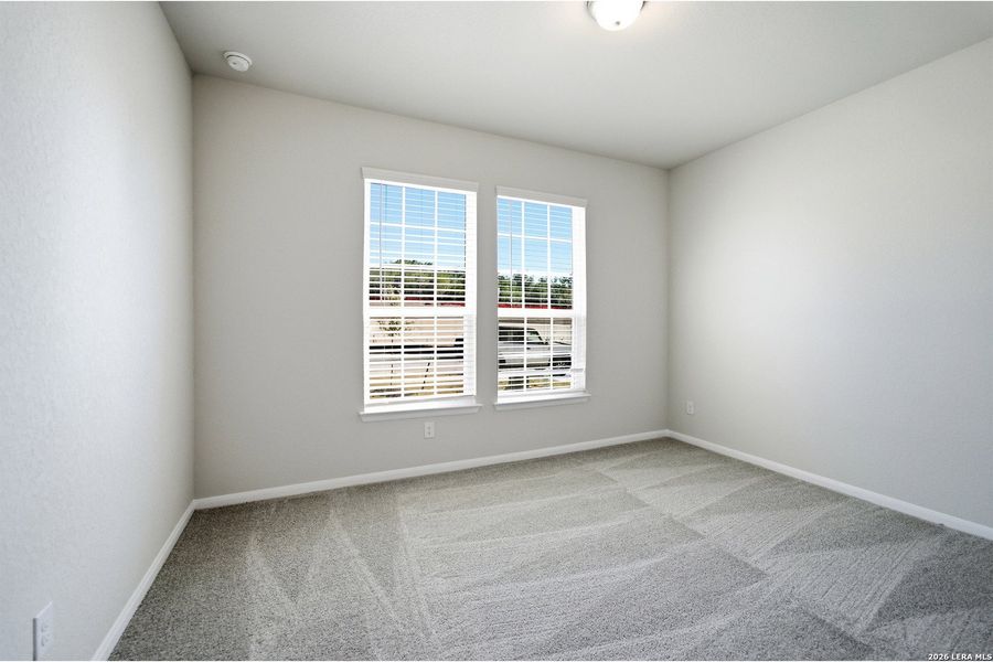 Spacious, unfurnished interior of a new home in The Woodlands at Medina Hills, Mico (Image 15).