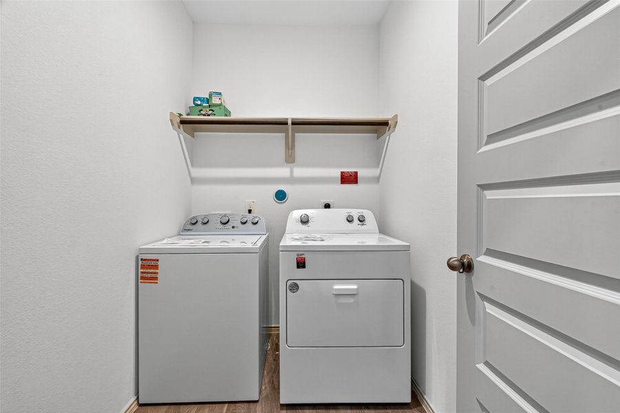 The utility room is on the first floor and the washer and dryer remain with the house.