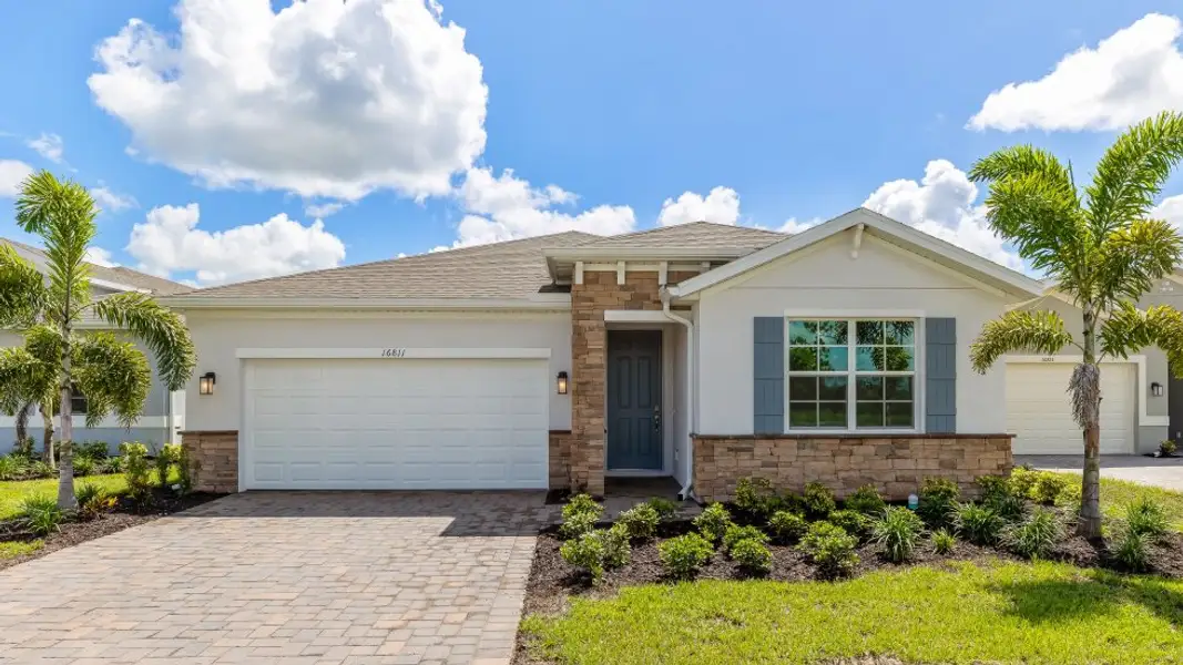 Front exterior of a new home in Stonewater, Cape Coral, FL, highlighting curb appeal (Image 1). Front exterior of a new home in Stonewater, Cape Coral, FL, highlighting curb appeal (Image 1).