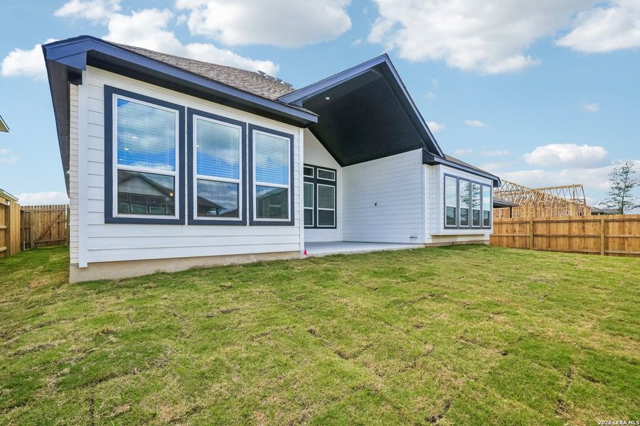 Exterior details and patio area of a home in Village at Three Oaks, Seguin (Image 4).