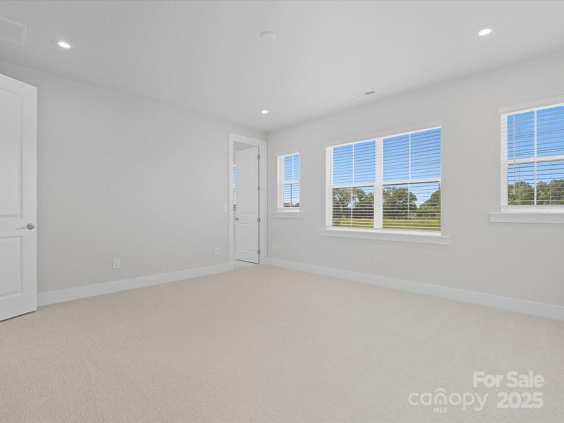 Primary suite with unobstructed views and natural light.