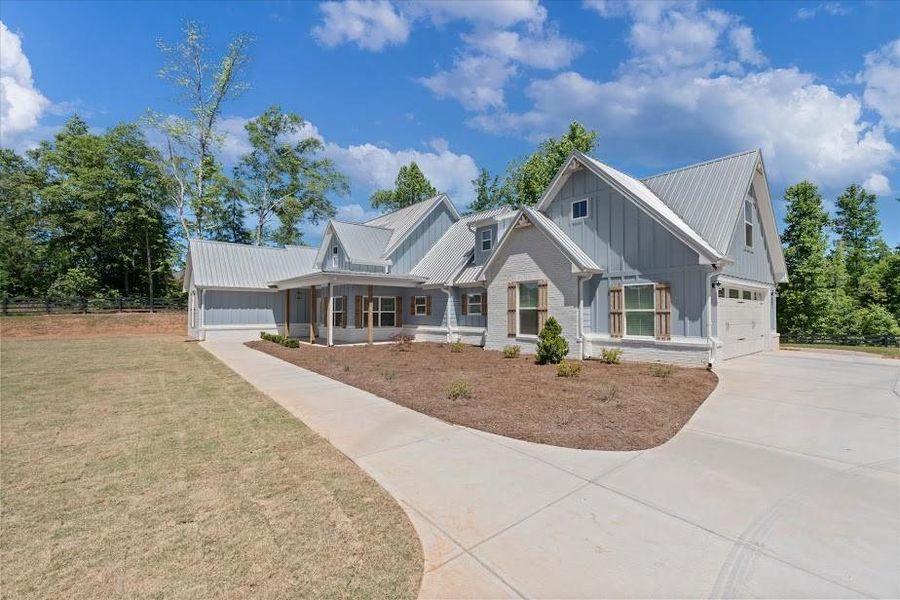 Front exterior of a new home in , Bremen, GA, highlighting curb appeal (Image 10).