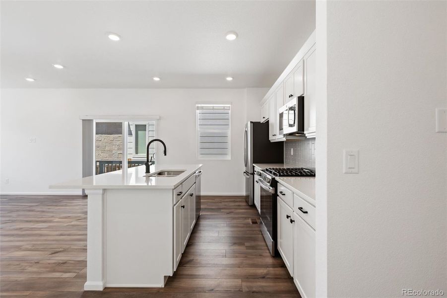 Furnished interior view inside a new home in Woodrose at Painted Prairie, Aurora (Image 5).