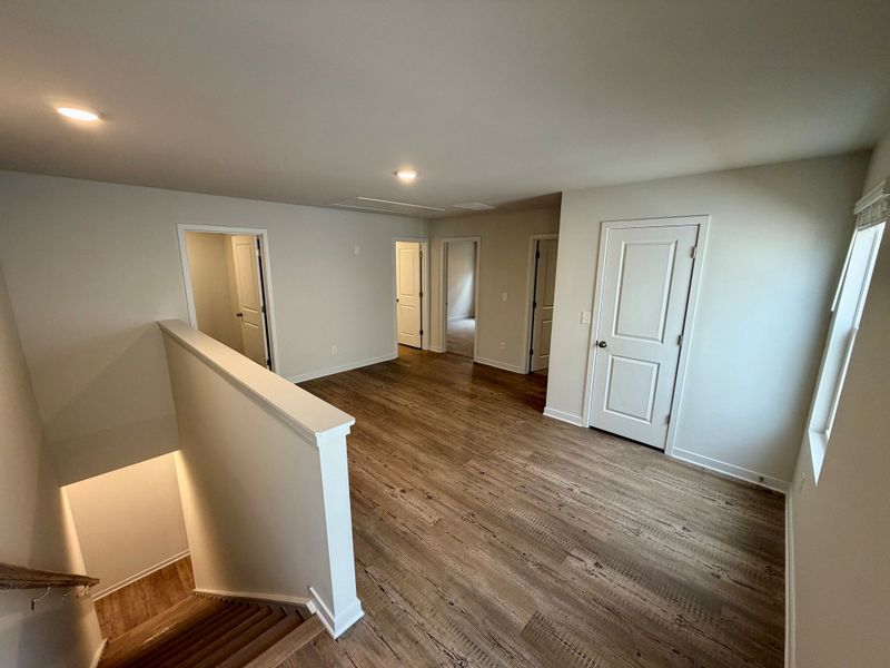 A room with white walls and wood floors. A room with white walls and wood floors.