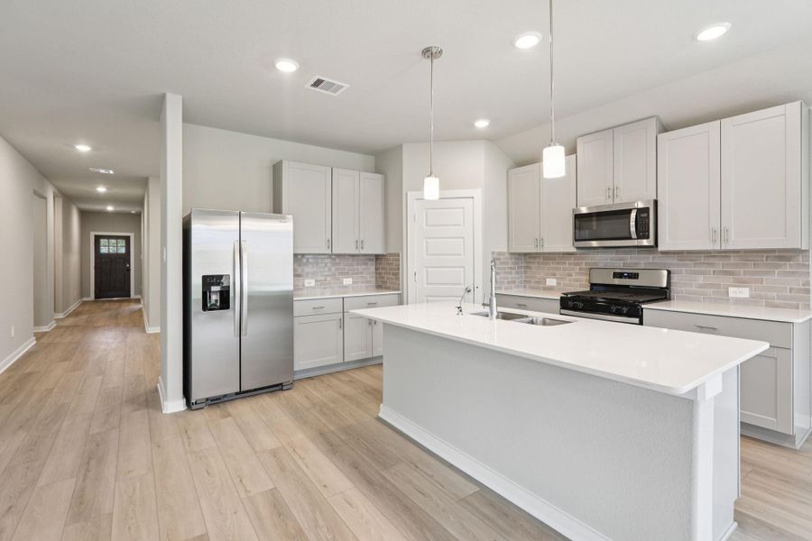 Furnished interior view inside a new home in Massey Oaks - Premier Series, Pearland (Image 11). Furnished interior view inside a new home in Massey Oaks - Premier Series, Pearland (Image 11).