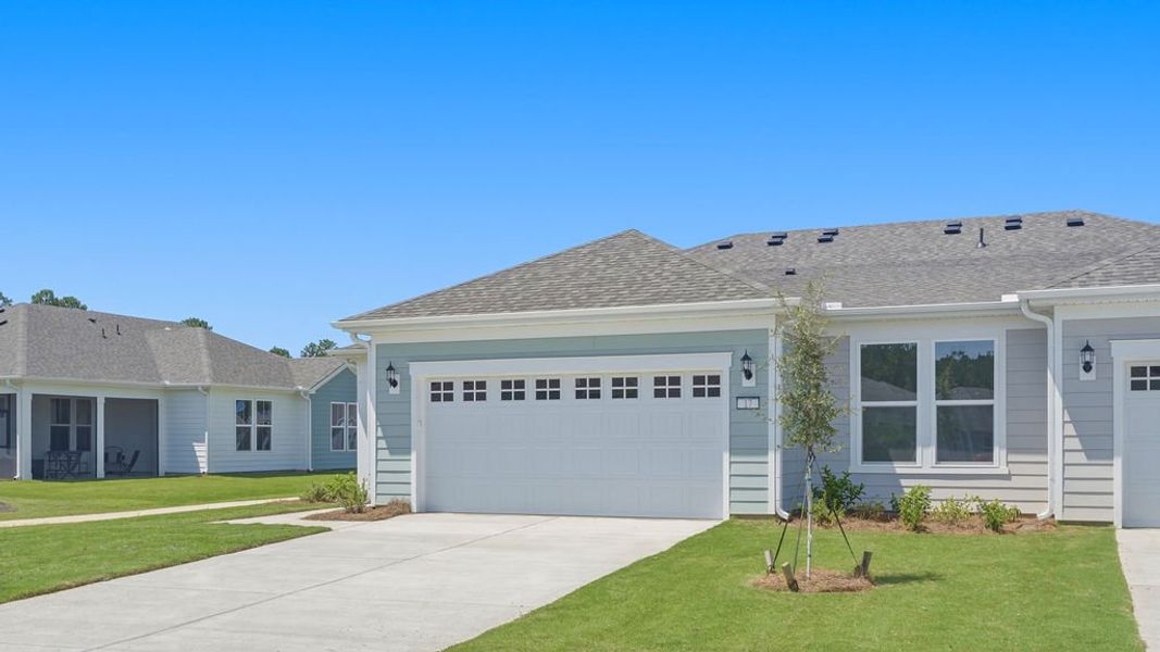 Front exterior of a new home in Sun City Hilton Head, Bluffton, SC, highlighting curb appeal (Image 21).