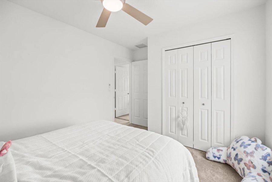 Second Bedroom Interior Highlighting Spacious Closet and Split-Plan Privacy