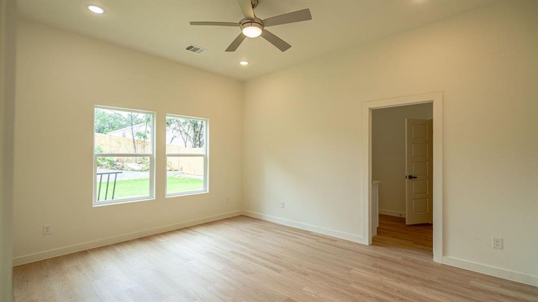 Primary bedroom with en suite bath and walk in closet