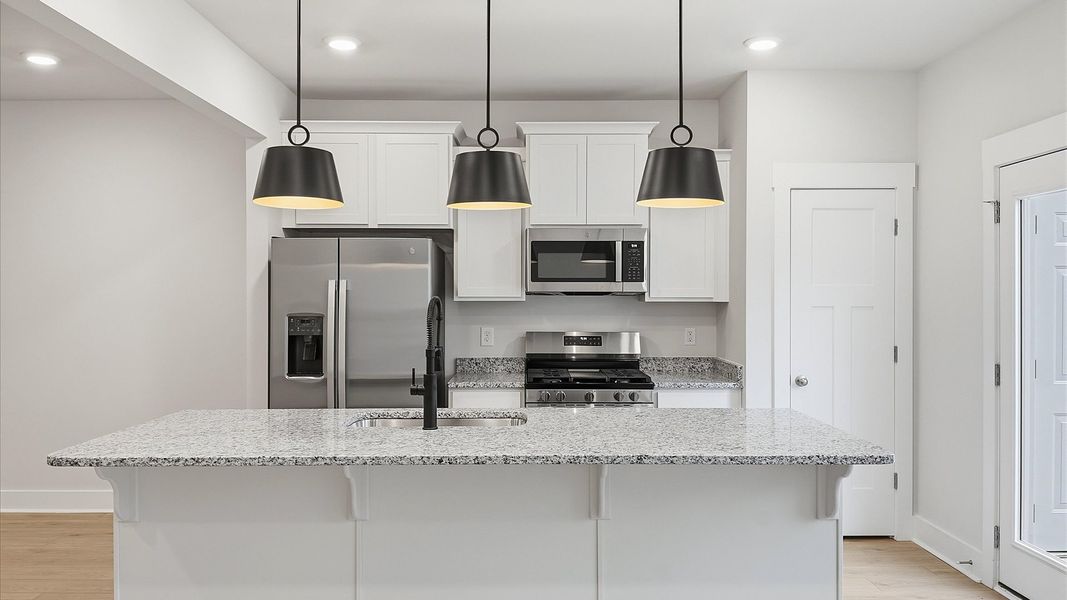 Well-designed kitchen with a center island and tasteful finishes that elevate everyday living in Lyman, SC Well-designed kitchen with a center island and tasteful finishes that elevate everyday living in Lyman, SC