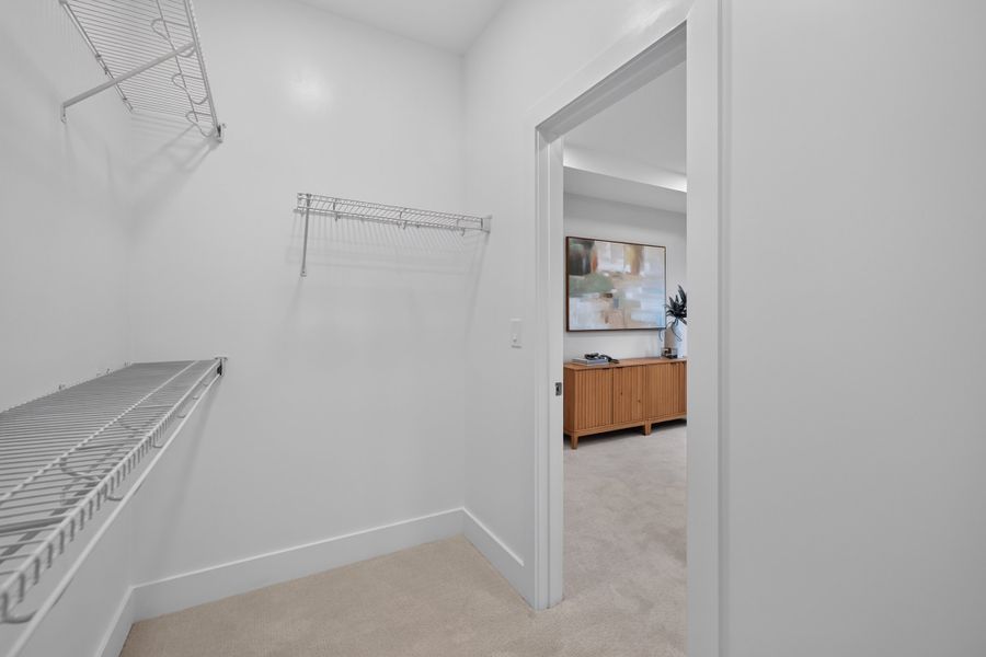 Primary Walk-In Closet Primary Walk-In Closet