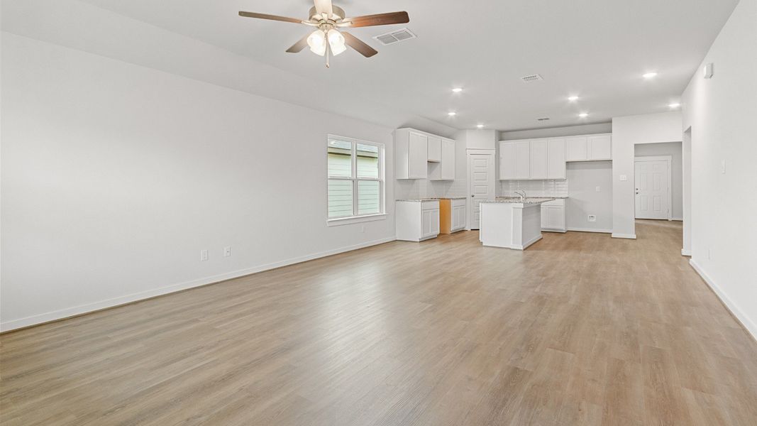 Representative furnished interior of a home built from the Kimbell by Brightland Homes in Sunterra, Katy (Image 10).