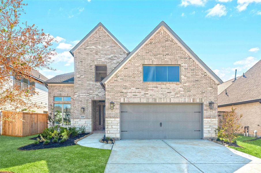 Front exterior of a new home in , Fulshear, TX, highlighting curb appeal (Image 1).