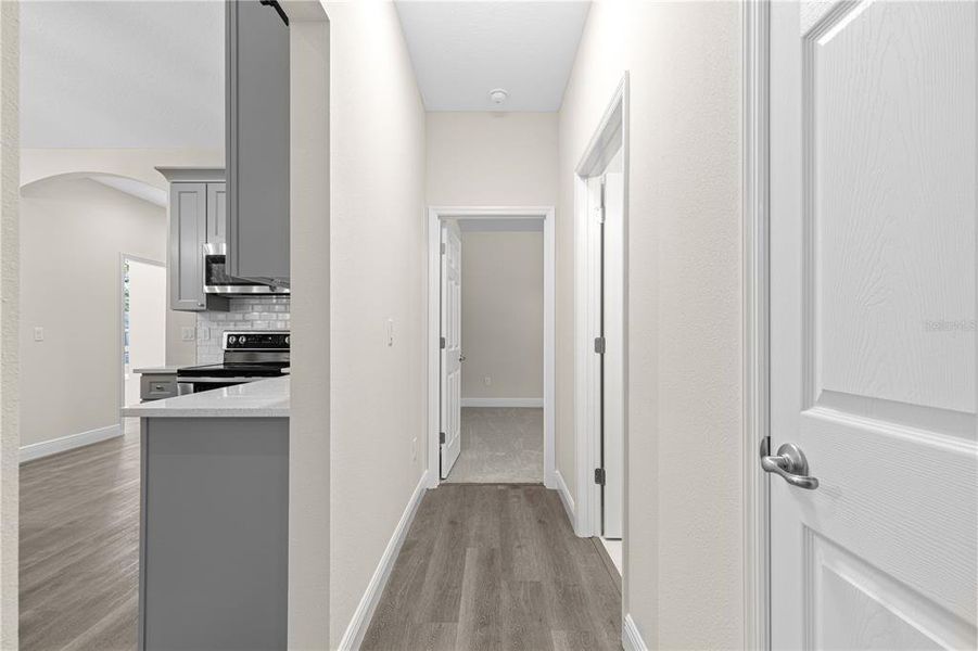 PRIVATE HALLWAY WITH SPLIT BEDROOMS, LINEN CLOSET AND FULL BATH