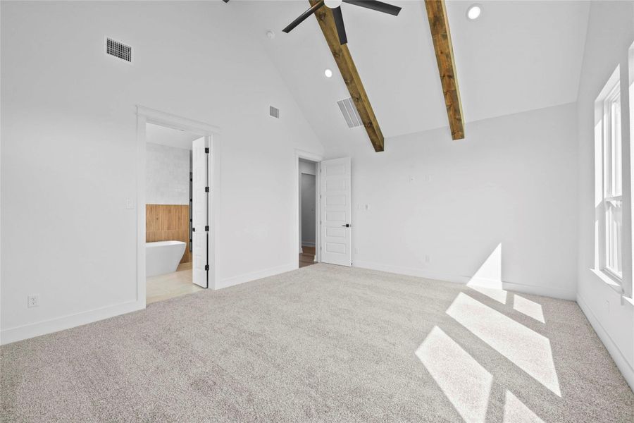 Unfurnished bedroom featuring high vaulted ceiling, light carpet, recessed lighting, ceiling fan, and beamed ceiling Unfurnished bedroom featuring high vaulted ceiling, light carpet, recessed lighting, ceiling fan, and beamed ceiling