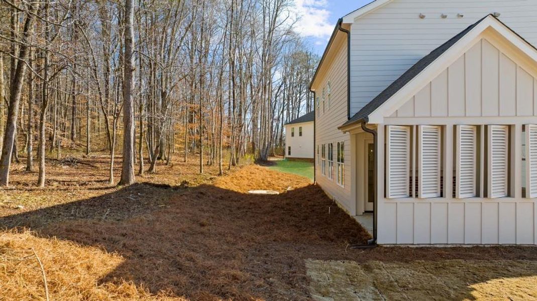Front exterior of a new home in , Canton, GA, highlighting curb appeal (Image 24).