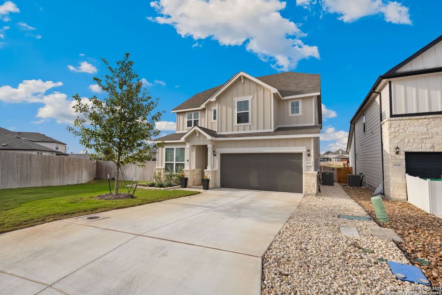 Front exterior of a new home in Lily Springs, Seguin, TX, highlighting curb appeal (Image 21).