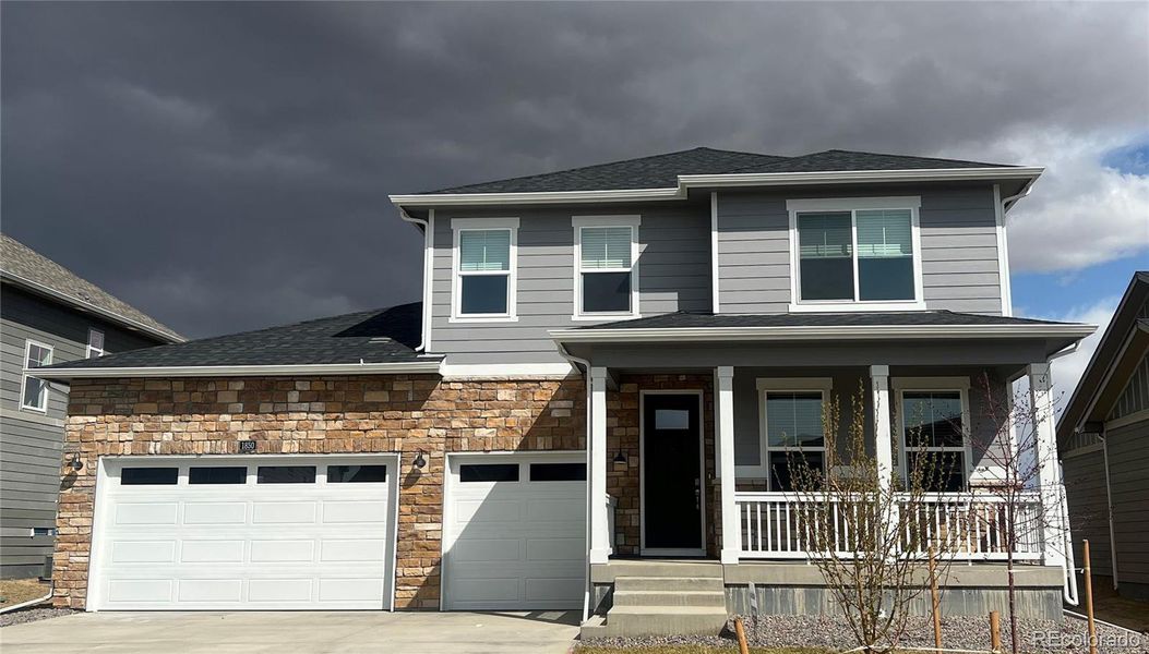 Front exterior of a new home in Vantage, Berthoud, CO, highlighting curb appeal (Image 1). Front exterior of a new home in Vantage, Berthoud, CO, highlighting curb appeal (Image 1).