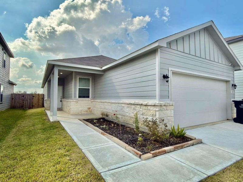 Exterior details and patio area of a home in Barrett Crossing, Crosby (Image 2).