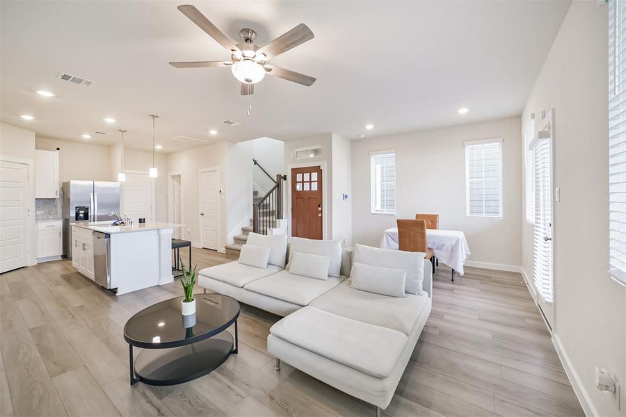 The living room, dining room and kitchen flow seamlessly. The living room, dining room and kitchen flow seamlessly.