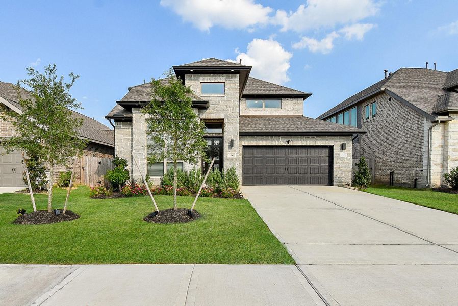 Front exterior of a new home in Stonecreek Estates 50', Richmond, TX, highlighting curb appeal (Image 22).