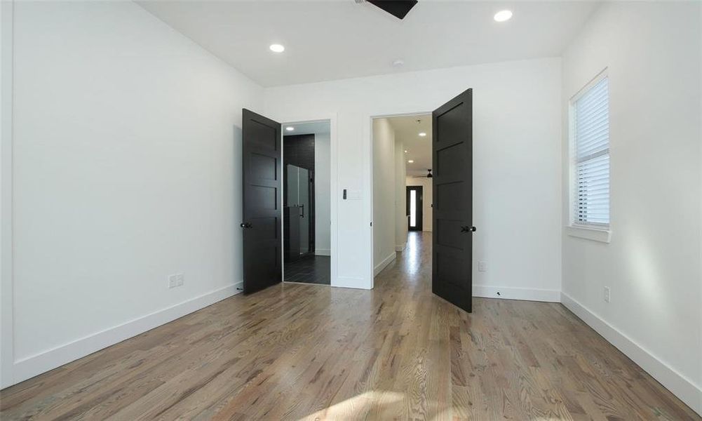 View from the sliding glass doors toward the hallway and ensuite bathroom.