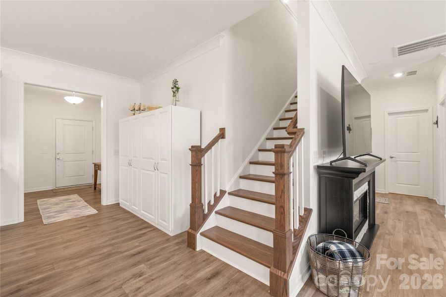 Wide staircase to the second story just off the kitchen with wooden treads is easy to keep clean