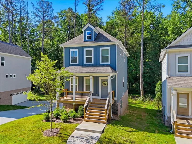 Front exterior of a new home in , Woodstock, GA, highlighting curb appeal (Image 25). Front exterior of a new home in , Woodstock, GA, highlighting curb appeal (Image 25).