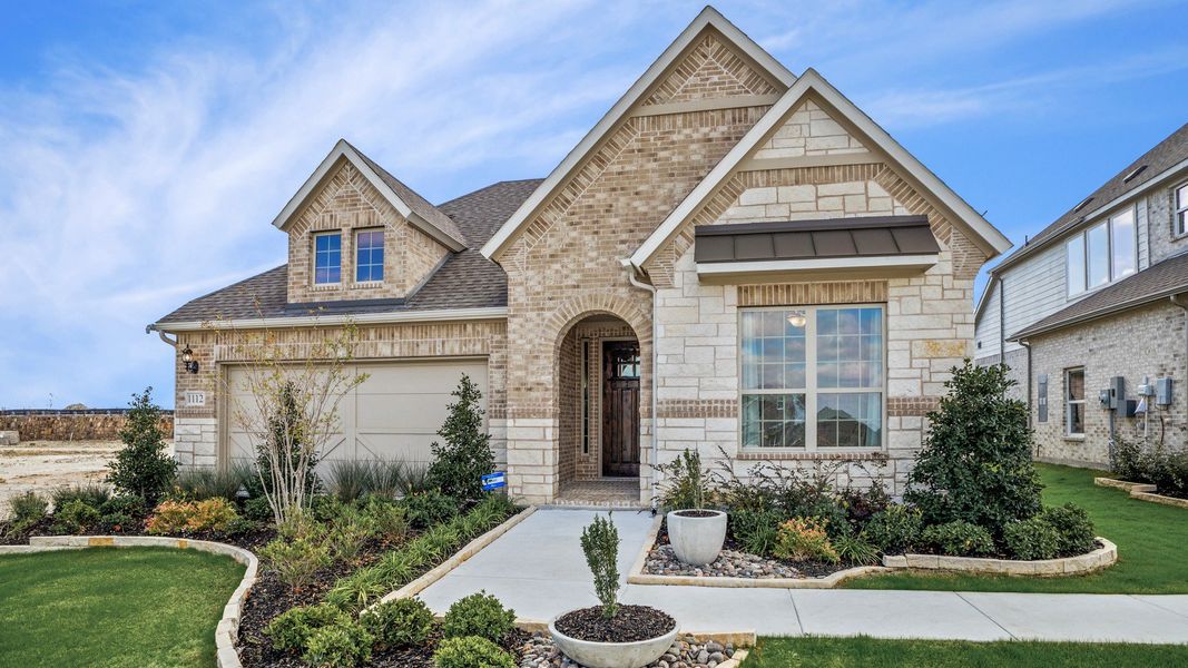 Front exterior of a new home in Anna Ranch, Anna, TX, highlighting curb appeal (Image 1). Front exterior of a new home in Anna Ranch, Anna, TX, highlighting curb appeal (Image 1).
