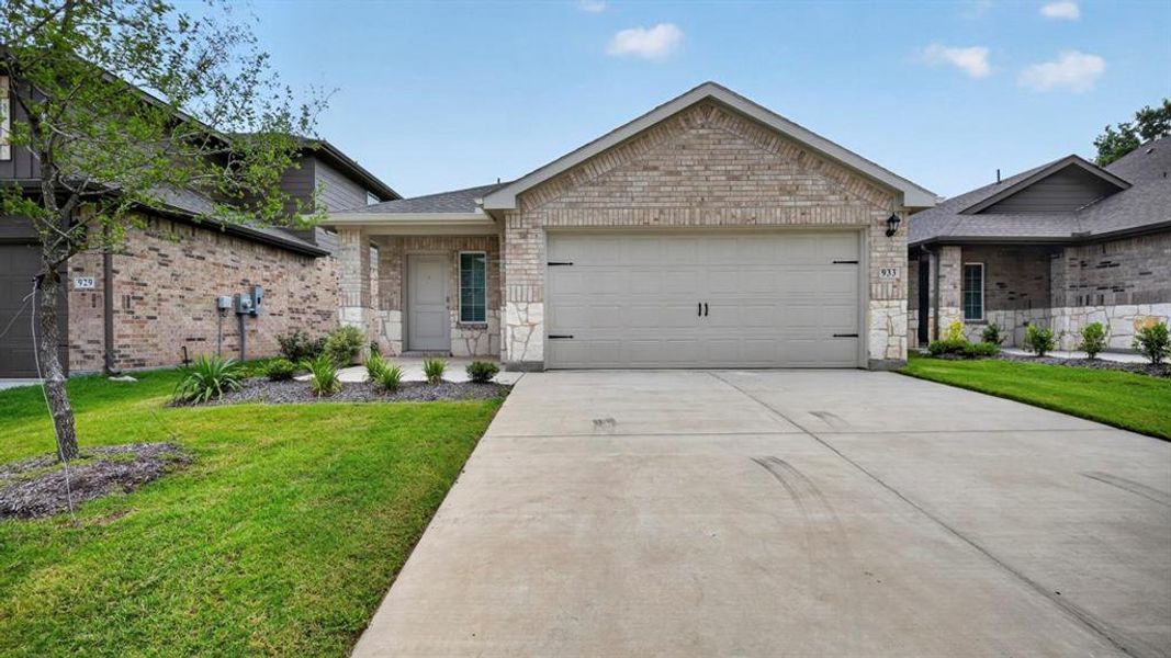 Front exterior of a new home in Hanolley Hills, Sherman, TX, highlighting curb appeal (Image 1). Front exterior of a new home in Hanolley Hills, Sherman, TX, highlighting curb appeal (Image 1).